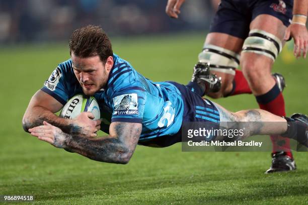 Blues Matt Moulds dives in for a try during the round 17 Super Rugby match between the Blues and the Reds at Eden Park on June 29, 2018 in Auckland,...