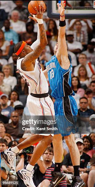 Tyrus Thomas of the Charlotte Bobcats goes up for a jump shot against Marcin Gortat of the Orlando Magic in Game Four of the Eastern Conference...