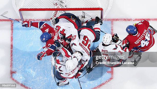 Players piles-up on goalie Semyon Varlamov of the Washington Capitals in Game Six of the Eastern Conference Quarterfinals during the 2010 NHL Stanley...