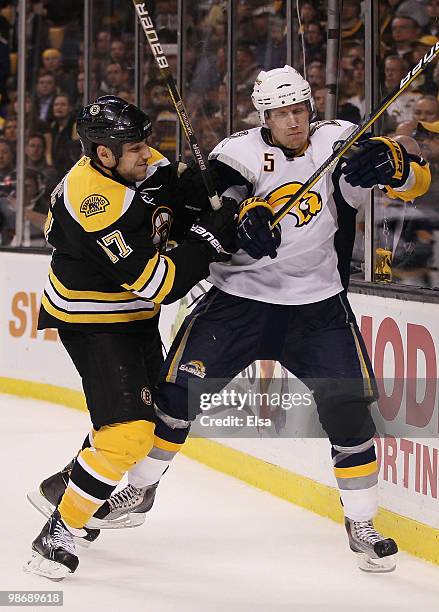 Milan Lucic of the Boston Bruins shoves Toni Lydman of the Buffalo Sabres in Game Six of the Eastern Conference Quarterfinals during the 2010 NHL...