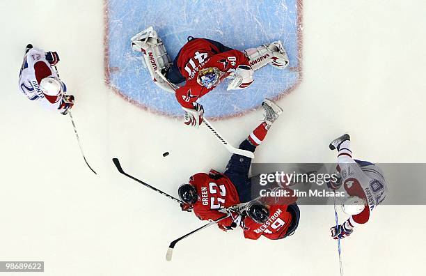 Semyon Varlamov, Mike Green, and Nicklas Backstrom of the Washington Capitals defend against Andrei Markov and Brian Gionta of the Montreal Canadiens...