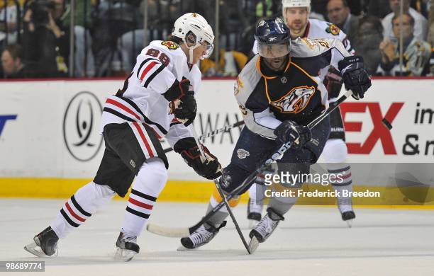 Joel Ward of the Nashville Predators watches the puck bounce past Patrick Kane of the Chicago Blackhawks in Game Six of the Western Conference...