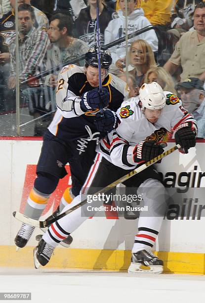 Jordin Tootoo of the Nashville Predators checks Ben Eager of the Chicago Blackhawks in Game Six of the Western Conference Quarterfinals during the...