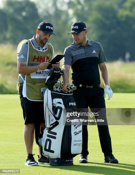 Tyrrell Hatton of England plays second shot on the 14th hole during the second round of the HNA Open de France at Le Golf National on June 29, 2018...