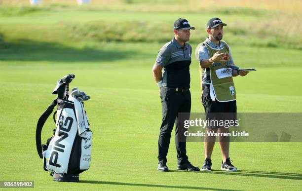 Tyrrell Hatton of England plays second shot on the 14th hole during the second round of the HNA Open de France at Le Golf National on June 29, 2018...