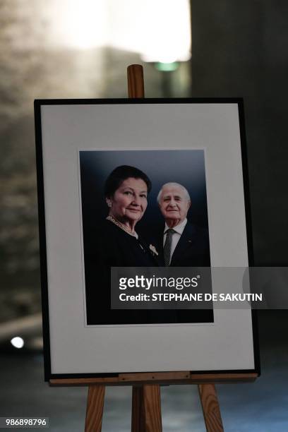 Collage of images of the late politician Simone Veil and her husband Antoine Veil next to their coffins at French Holocaust memorial in Paris on June...