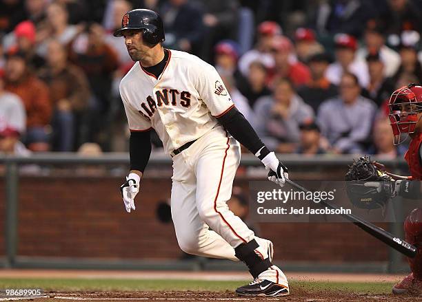 Mark DeRosa of the San Francisco Giants hits a two run single against the Philadelphia Phillies in the first inning during an MLB game at AT&T Park...