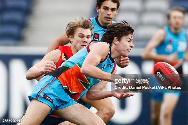 Thomas Green of the Allies handpasses the ball during the AFL U18 Championships match between the Allies and South Australia at GMHBA Stadium on June...