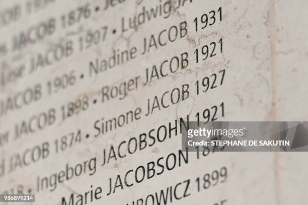 French women's rights icon, politician and Holocaust survivor Simone Jacob is etched on the Wall of Names at the French Holocaust memorial in Paris...