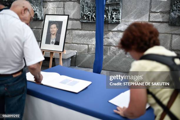 People arrive to pay their respects to women's rights icon, French politician and Holocaust survivor Simone and her husband Antoine Veil at the...