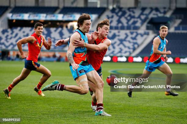 Rhyan Mansell of the Allies kicks the ball under pressure during the AFL U18 Championships match between the Allies and South Australia at GMHBA...