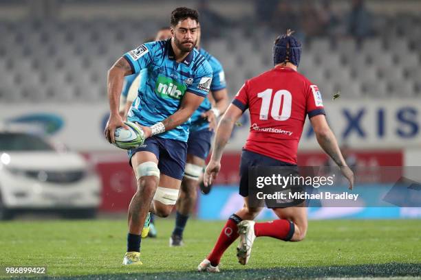 Blues Akira Ioane runs towards Reds Hamish Stewart during the round 17 Super Rugby match between the Blues and the Reds at Eden Park on June 29, 2018...