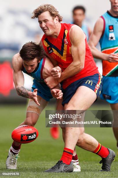 Will Gould of South Australia and Rhyan Mansell of the Allies contest the ball during the AFL U18 Championships match between the Allies and South...