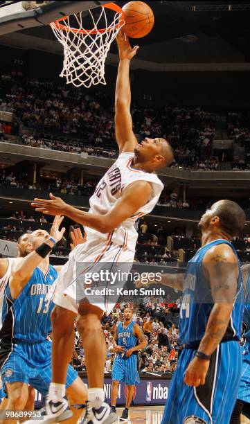 Boris Diaw of the Charlotte Bobcats goes for the layup against Marcin Gortat of the Orlando Magic in Game Four of the Eastern Conference...