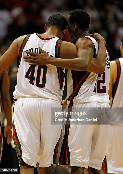 Kurt Thomas and Luc Richard Mbah a Moute of the Milwaukee Bucks walk off the court after a win over the Atlanta Hawks in Game Four of the Eastern...