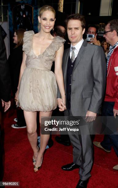 Actors Leslie Bibb and Sam Rockwell arrives at the "Iron Man 2" World Premiere at El Capitan Theatre on April 26, 2010 in Hollywood, California.