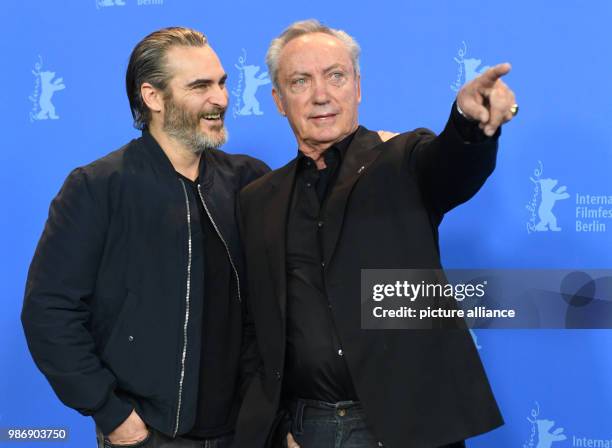 February 2018, Germany, Berlin, Berlinale, photocall, 'Don't Worry, He Won't Get Far on Foot': Actors Joaquin Phoenix and Udo Kier. The film runs in...