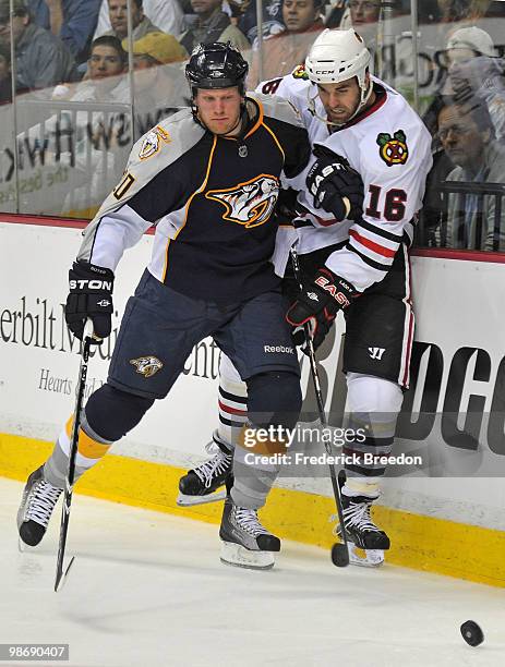 Ryan Suter of the Nashville Predators checks Andrew Ladd of the Chicago Blackhawks in Game Six of the Western Conference Quarterfinals during the...