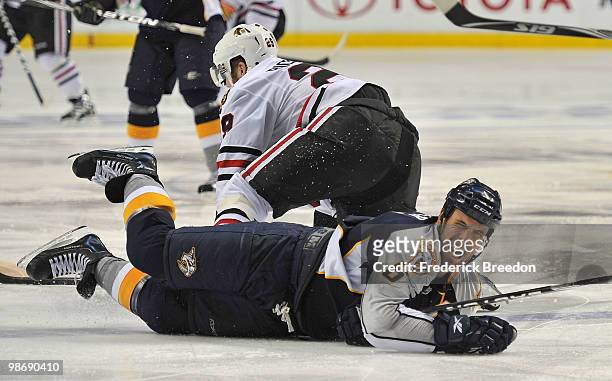 Shea Weber of the Nashville Predators grimmaces after colliding with Bryan Bickell of the Chicago Blackhawks in Game Six of the Western Conference...