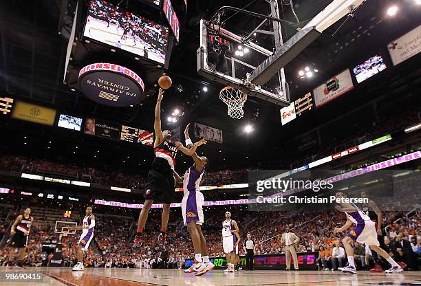 Marcus Camby of the Portland Trail Blazers puts up a shot over Channing Frye of the Phoenix Suns during Game Five of the Western Conference...