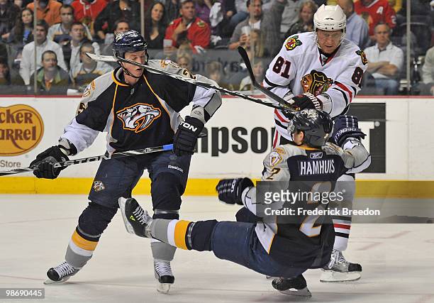 Jerred Smithson of the Nashville Predators watches as teammate Dan Hamhuis is checked by Marian Hossa of the Chicago Blackhawks in Game Six of the...