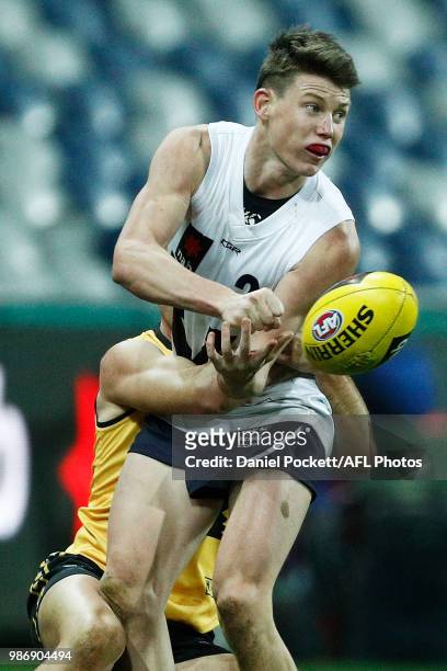 Samuel Walsh of Vic Country handpasses the ball during the AFL U18 Championships match between Vic Country and Western Australia at GMHBA Stadium on...