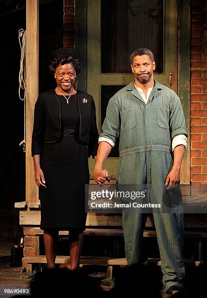 Actress Viola Davis and actor Denzel Washington take a bow during the curtain call for the Broadway Opening of "Fences" at the Cort Theatre on April...