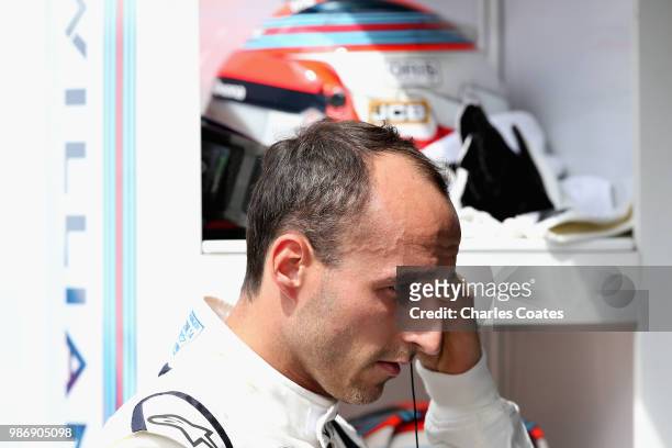 Robert Kubica of Poland and Williams prepares to drive in the garage during practice for the Formula One Grand Prix of Austria at Red Bull Ring on...