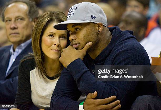 Carolina Panthers wide receiver Steve Smith and his wife Angie sit courtside during the NBA basketball game between the Orlando Magic and the...