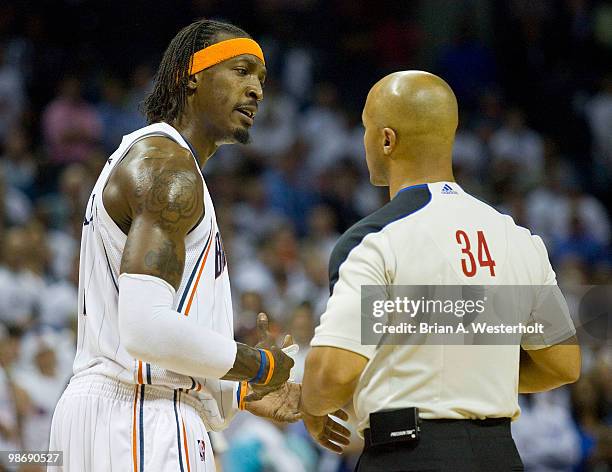 Gerald Wallace of the Charlotte Bobcats discusses a call with official Marc Davis during fourth quarter action against the Orlando Magic in Game Four...