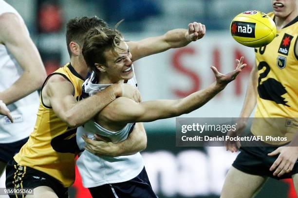 Zane Barzen of Vic Country handpasses the ball during the AFL U18 Championships match between Vic Country and Western Australia at GMHBA Stadium on...