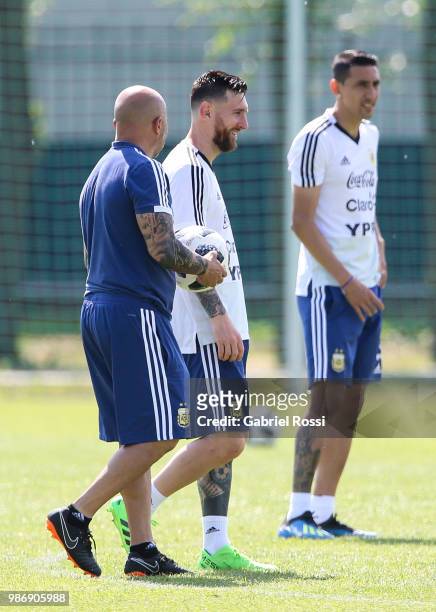 Lionel Messi of Argentina and Jorge Sampaoli coach of Argentina talk during a training session at Stadium of Syroyezhkin sports school on June 28,...