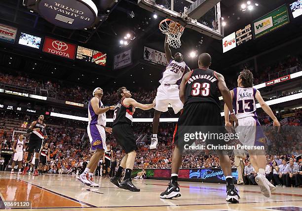 Jason Richardson of the Phoenix Suns slam dunks the ball over Rudy Fernandez of the Portland Trail Blazers during Game Five of the Western Conference...