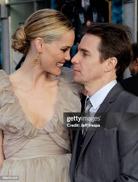 Actors Leslie Bibb and Sam Rockwell arrive at the "Iron Man 2" World Premiere at El Capitan Theatre on April 26, 2010 in Hollywood, California.