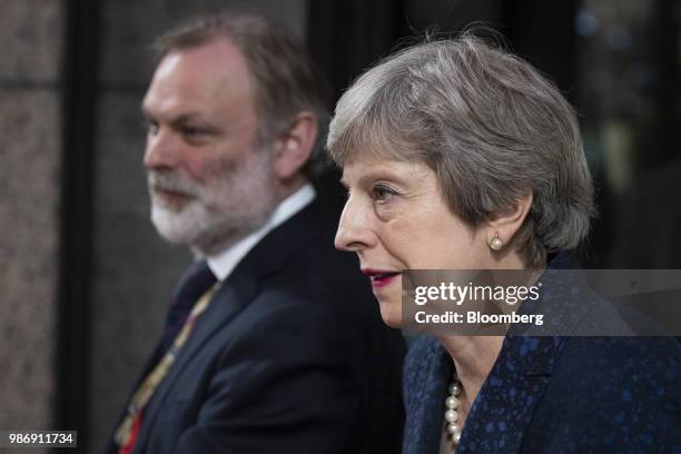 Theresa May, U.K. Prime minister, and Tim Barrow, U.K. Permanent representative to the European Union , depart following a European Union leaders...