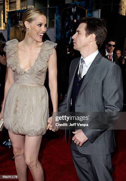 Actors Leslie Bibb and Sam Rockwell arrive at the "Iron Man 2" World Premiere at El Capitan Theatre on April 26, 2010 in Hollywood, California.