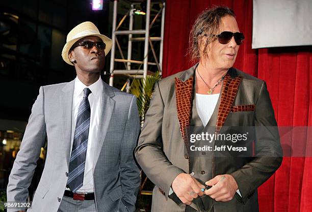 Actors Don Cheadle and Mickey Rourke onstage at the "Iron Man 2" World Premiere at El Capitan Theatre on April 26, 2010 in Hollywood, California.