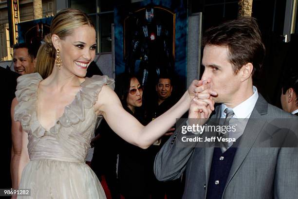 Actors Leslie Bibb and Sam Rockwell arrive at the "Iron Man 2" World Premiere at El Capitan Theatre on April 26, 2010 in Hollywood, California.