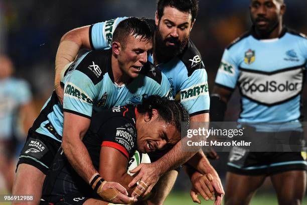 Isaiah Papalii is tackled during the round 16 NRL match between the New Zealand Warriors and the Cronulla Sharks at Mt Smart Stadium on June 29,...