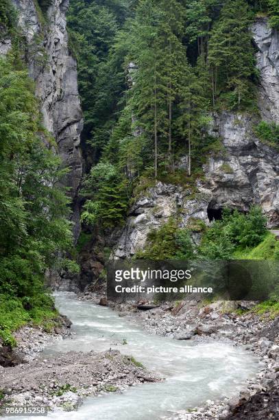 June 2018, Germany, Garmisch-Partenkirchen: The Partnach flows calmly into the Partnach Gorge. Photo: Angelika Warmuth/dpa