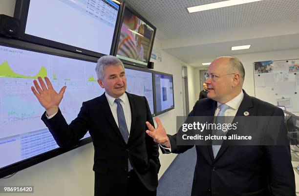 February 2018, Germany, Bonn: Arne Schoenbohm , President of the Bundesamt für Sicherheit in der Informationstechnik speaks with Andreas Pinkwart ,...