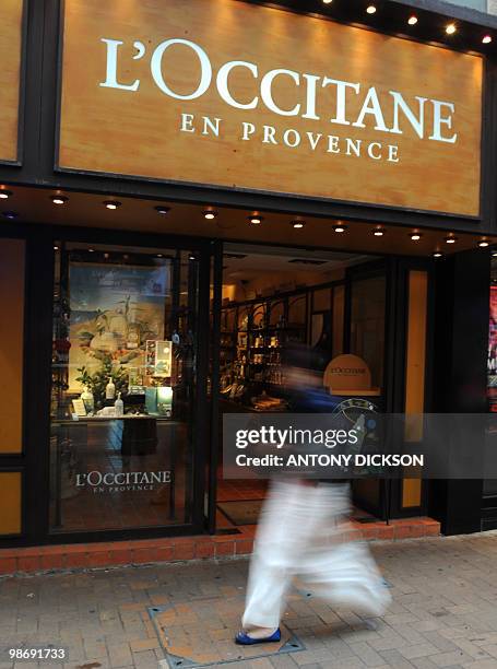 Pedestrian walks past a L'Occitane outlet in Hong Kong on April 27, 2010. French cosmetics group L'Occitane on April 26 began inviting subscriptions...