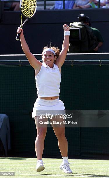 Virginia Ruano Pascual of Spain celebrates her straight sets victory over Martina Hingis of Switzerland during the womens first round of The All...