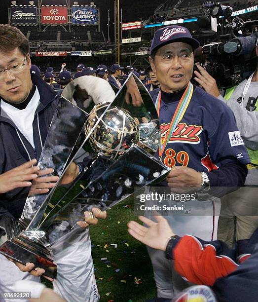 Japan's head coach Sadaharu Oh holds the trophy after winning the Final game of the World Baseball Classic at Petco Park on March 20, 2006 in San...