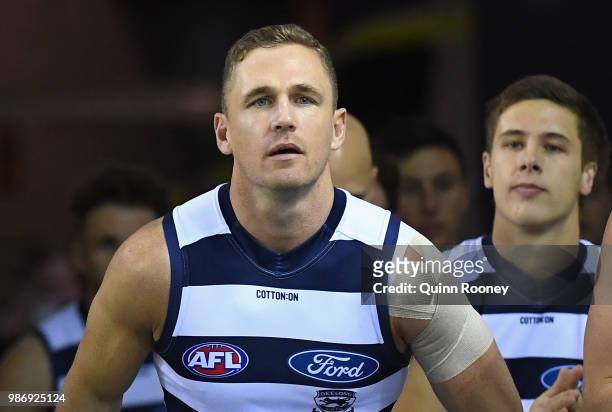 Joel Selwood of the Cats leads his team out onto the field during the round 15 AFL match between the Western Bulldogs and the Geelong Cats at Etihad...