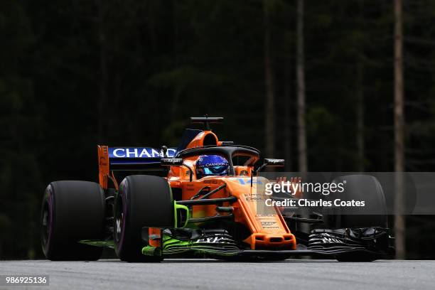 Fernando Alonso of Spain driving the McLaren F1 Team MCL33 Renault on track during practice for the Formula One Grand Prix of Austria at Red Bull...