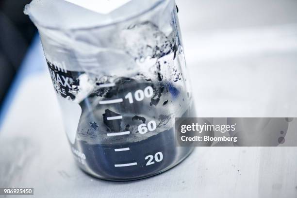 Graphene slurry, containing graphene and polymer binders, sits in a beaker inside a laboratory at the National Graphene Institute facility, part of...