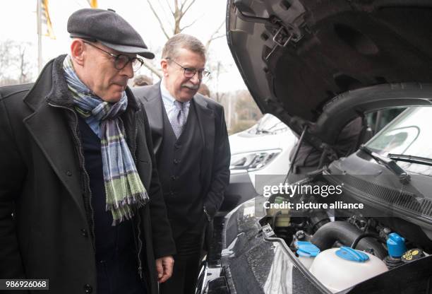 Febuary 2018, Germany, Stuttgart: Winfried Hermann , Transport Minister of Baden-Wuerttemberg of the Alliance 90/The Greens, standing with Dieter...