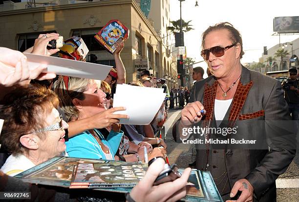 Actor Mickey Rourke signs autographs as he arrive at the world wide premiere of "Iron Man 2" Premiere held at the El Capitan Theatre on April 26,...
