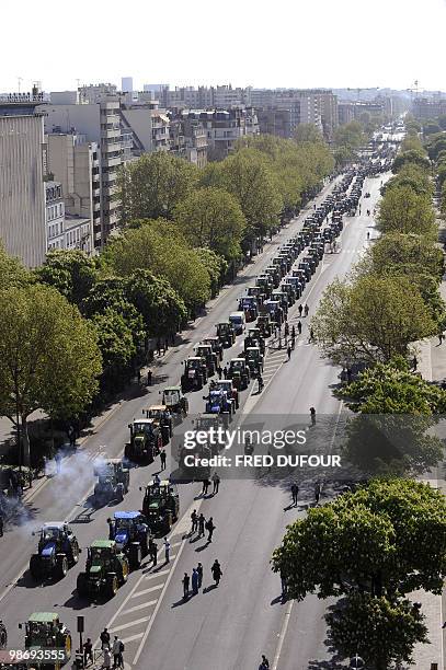 French farmers drive their tractors in Paris on April 27, 2010 before demonstrating against wages cut and to denounce the European Farm Policy. The...